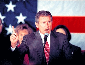Bush lashes out at critics who "insist on harping on bygones when Americans are hurting today."